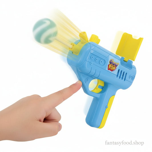 Meccanismo funzionante del Candy Toy Johny Bee Gun Pop: la pressione del grilletto fa uscire il lecca-lecca.