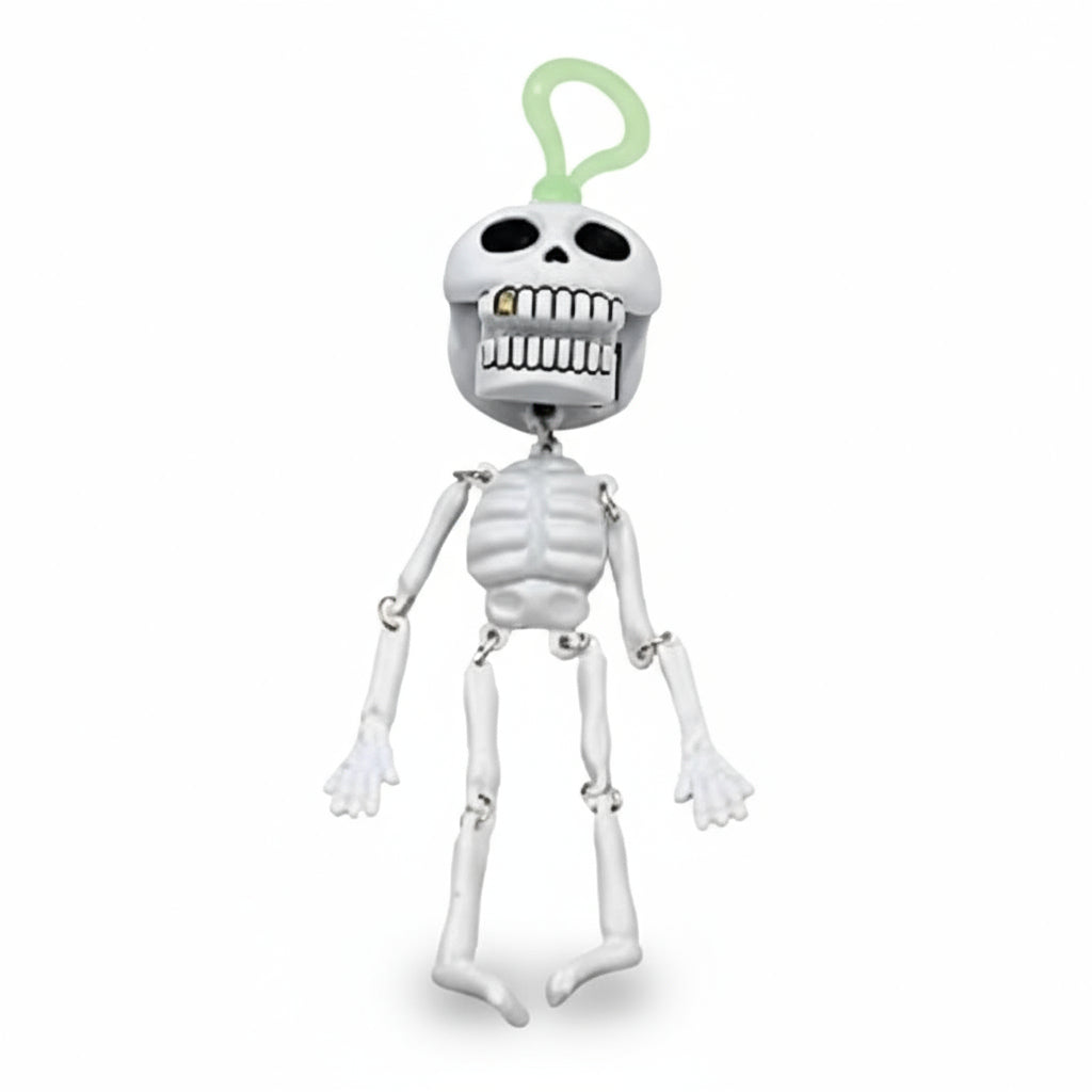 Caramella JOYGUM SUPER TESCHIO in un dispenser giocattolo a forma di teschio con funzione di portachiavi. La confezione Happy Halloween contiene caramelle gommose al gusto di frutta. Gadget e dolciumi da collezione a tema Halloween.